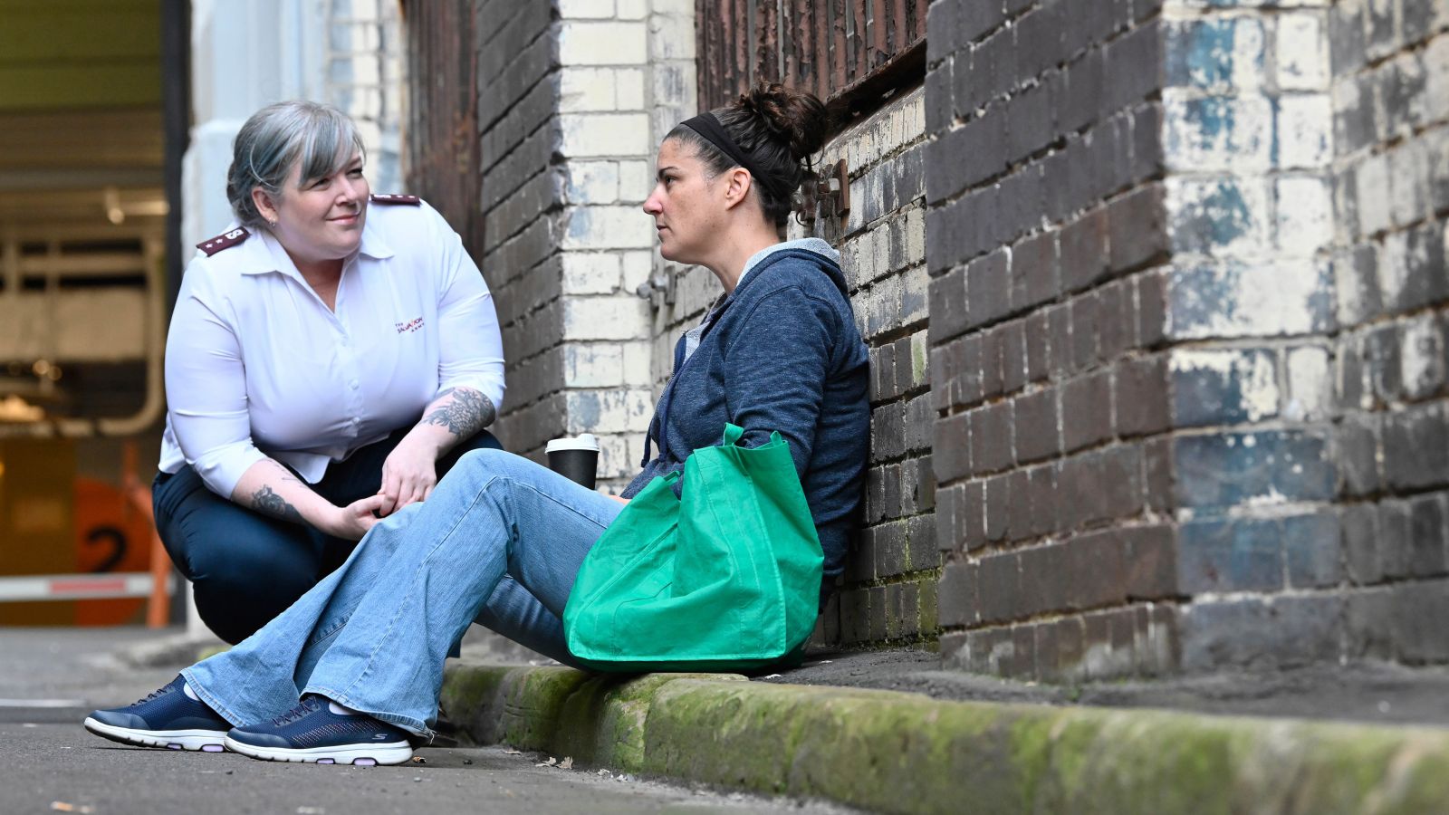 homelessness support workers helping young mother and family