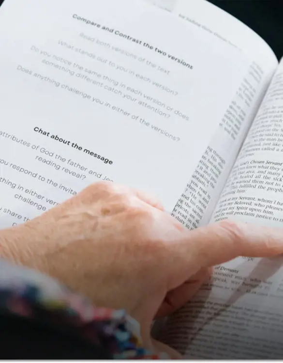 Someone reading a bible passage.