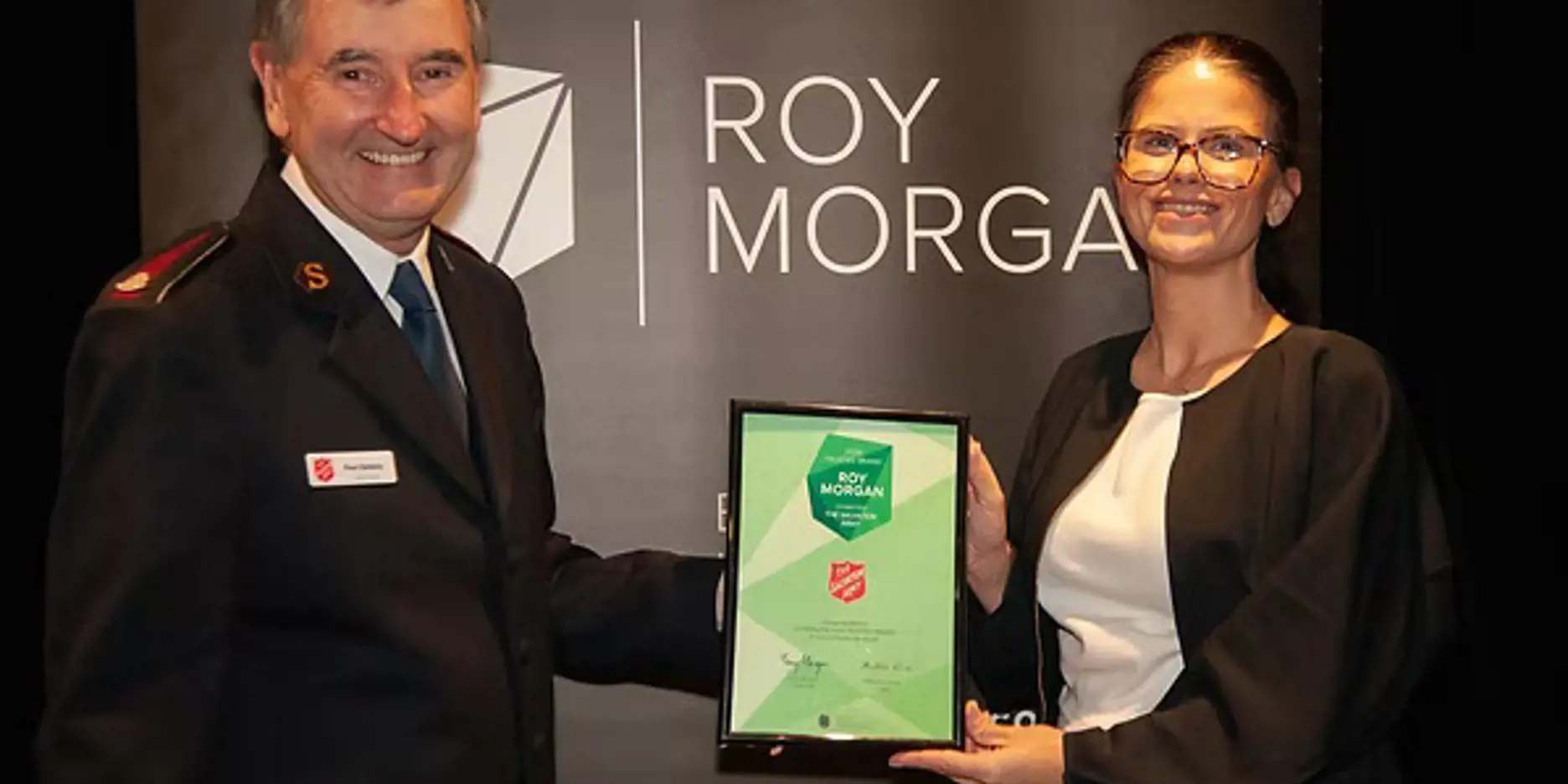 Lieutenant-Colonel Paul Hateley (Secretary for Communications) and Amity Cartwright (Head of Brand and Marketing) with the Charity of the Year award.