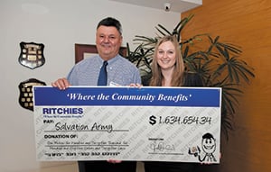 Photo: Fred Harrison, CEO of Ritchies, with Amy Baker from the Salvos.