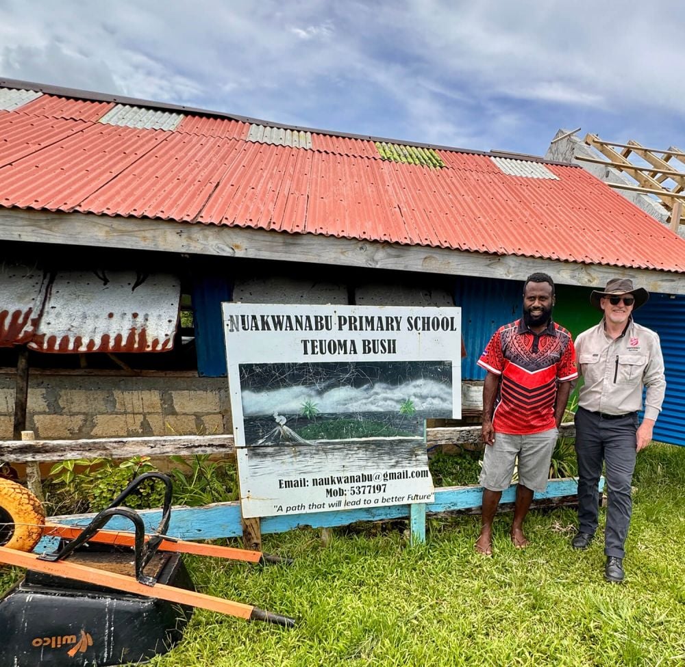 (Left) Philimon Joseph, Head Teacher at Nuakwanabu Primary School with Daryl Crowden, General Manager SAES