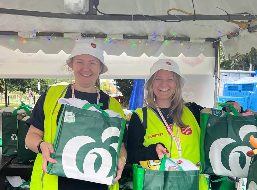 Volunteers with woolworths bag