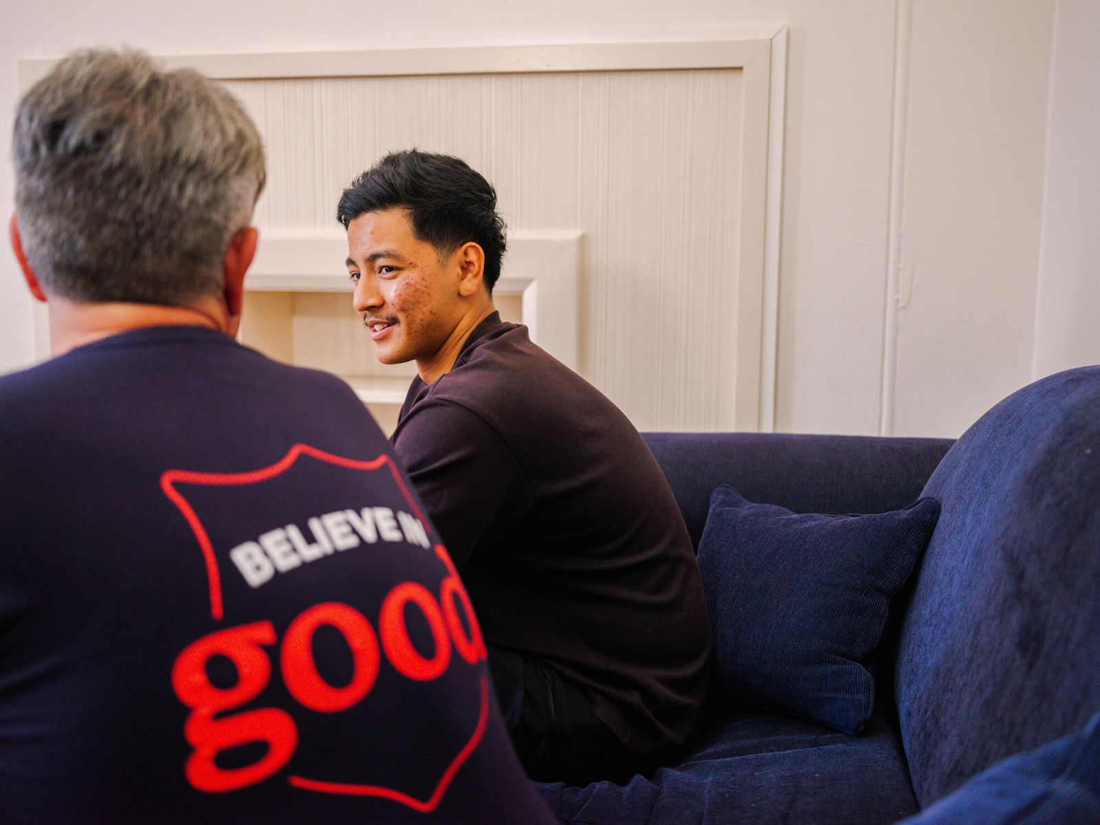 Salvos personnel talking to a young man