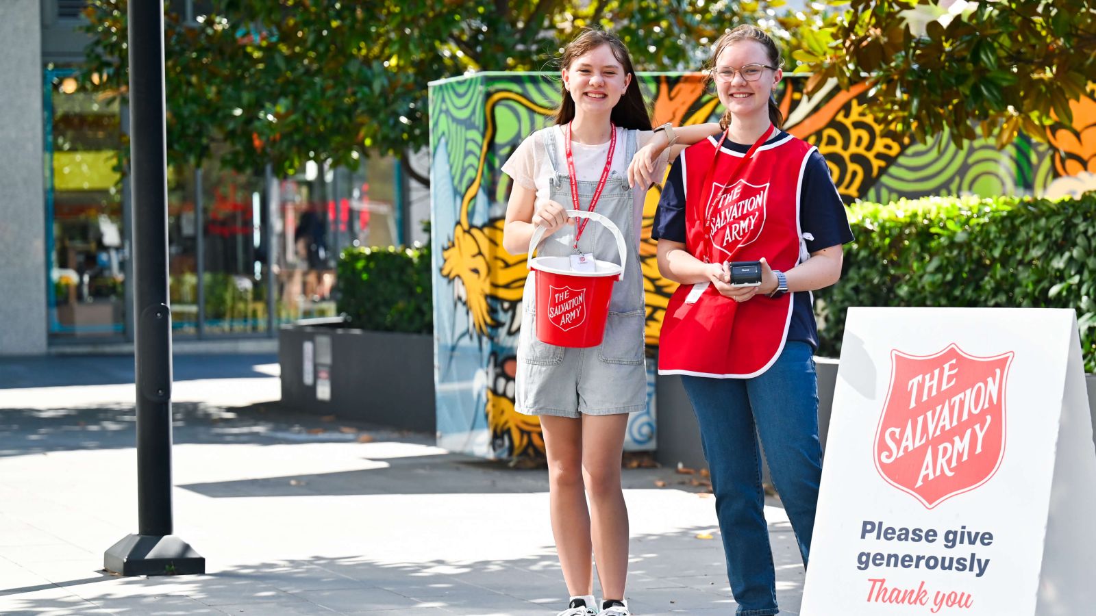 Two girls volunteering for Red Shield Appeal