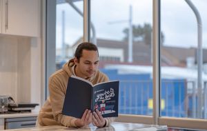 Troy turns tough lessons into Moneycare message for students