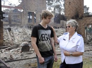 Salvation Army volunteer speaks with bushfire victim