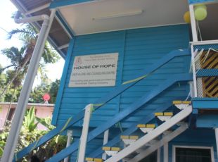 Photograph of the sign 'House of hope' which is on the side of the womens’ refuge.