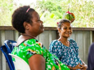 Two women sitting in the refuge.