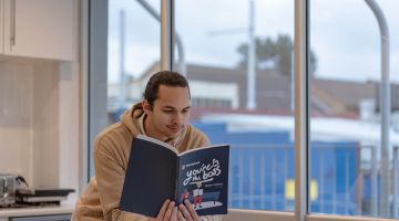 Troy turns tough lessons into Moneycare message for students