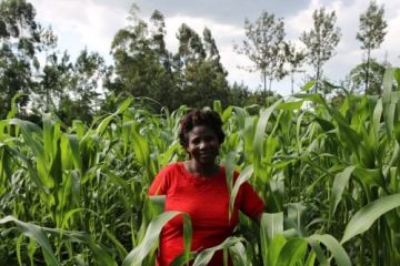 Woman standing in a field.