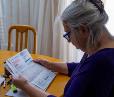 A woman staring at a household bill