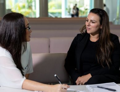 Gift in wills staff helping a lady with her will.