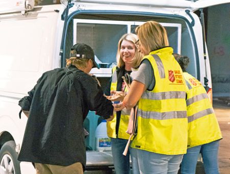 outreach team helps a homeless man