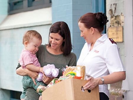 Mother and baby receive a food hamper