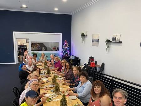 Peaople seated at table eating