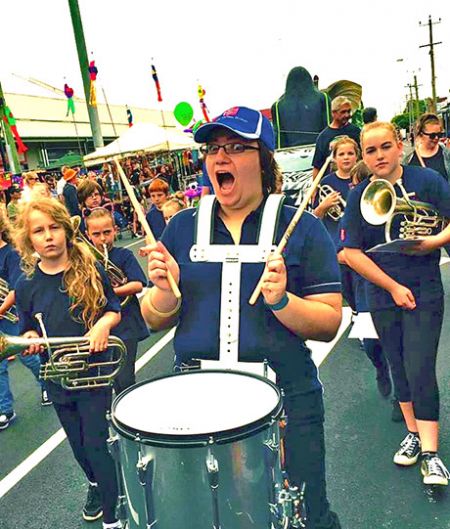 Britteny leads the march with drums
