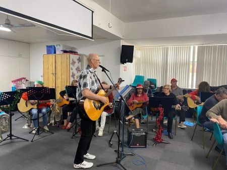 Man singing and playing guitar