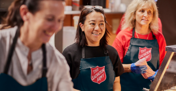 Salvos corporate volunteers serving food 