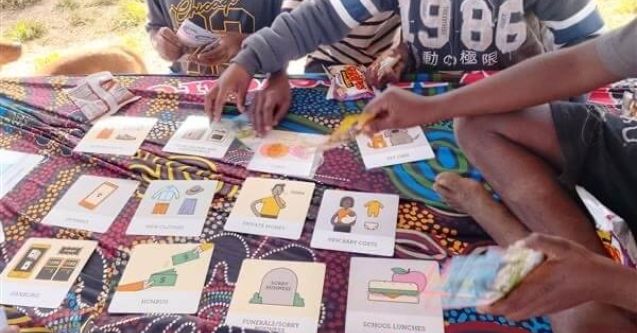 This photo shows local community children engaging in money games, early intervention. This is called Needs and Wants