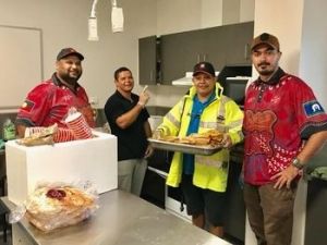 Volunteers working hard in the kitchen.