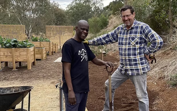 Coordinator Rick Mierisch with gardener TK in the Riverside Salvos community space.