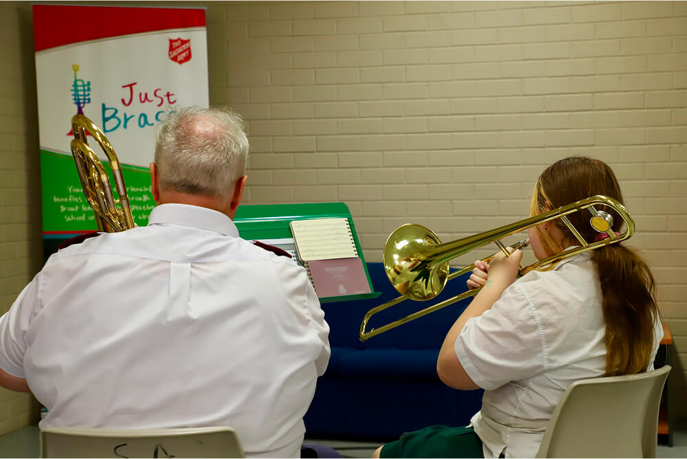 The Salvation Army's Colin Young accompanies a Just Brass student