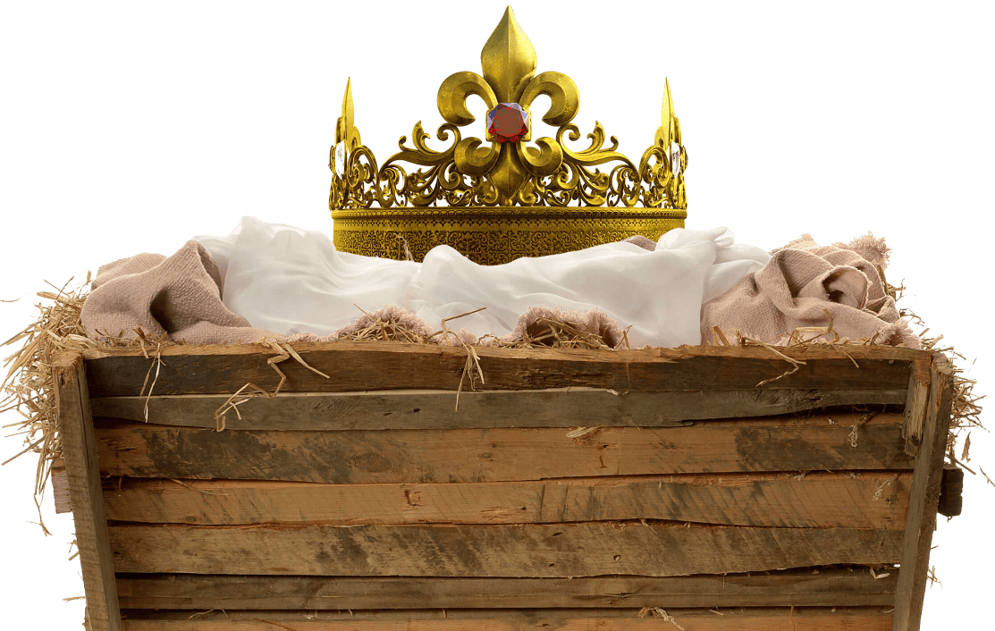 A golden crown rests upon a simple wooden manger set with white linen babies bedding and straw.