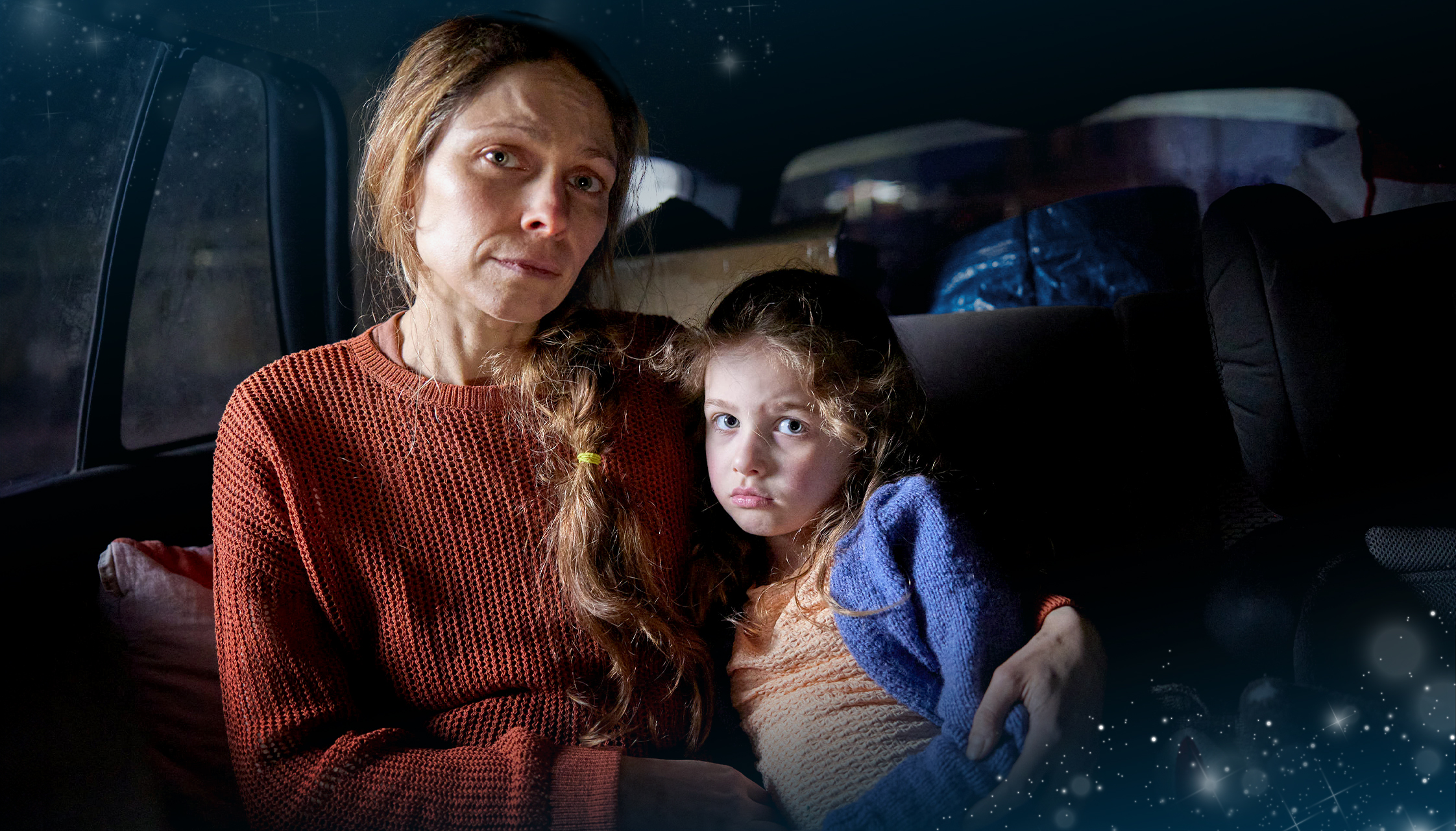 Sophie and Taylor are in a packed car, fleeing their home.