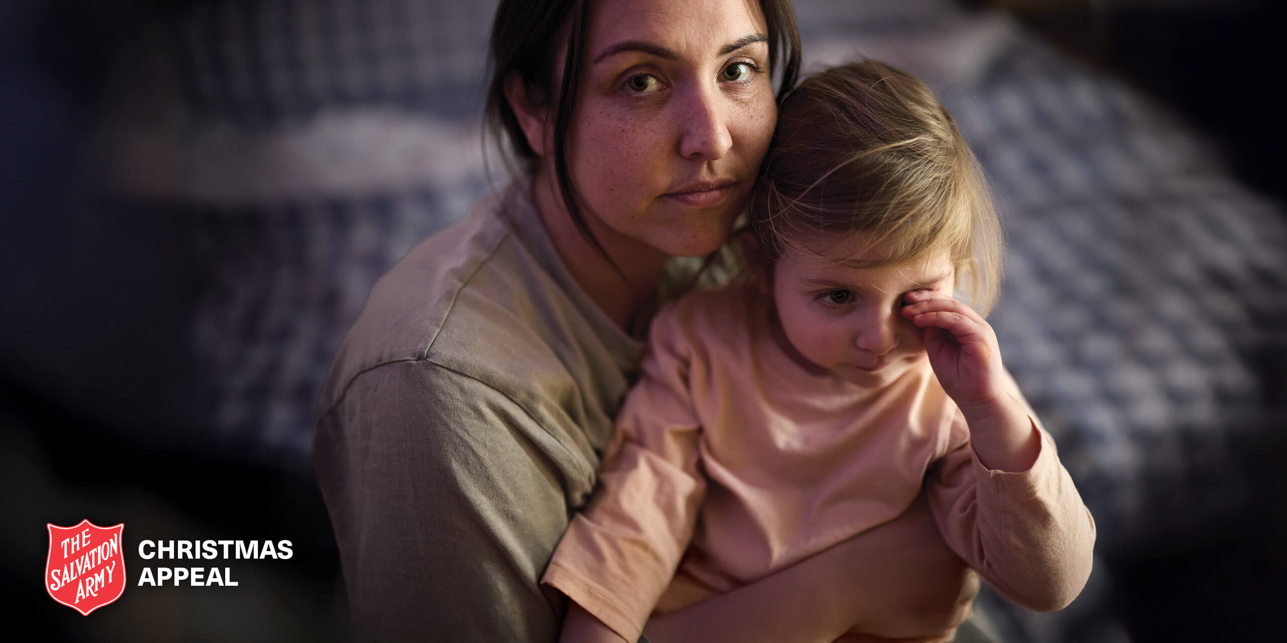 Paula looking distressed, with your young daughter in her arms.