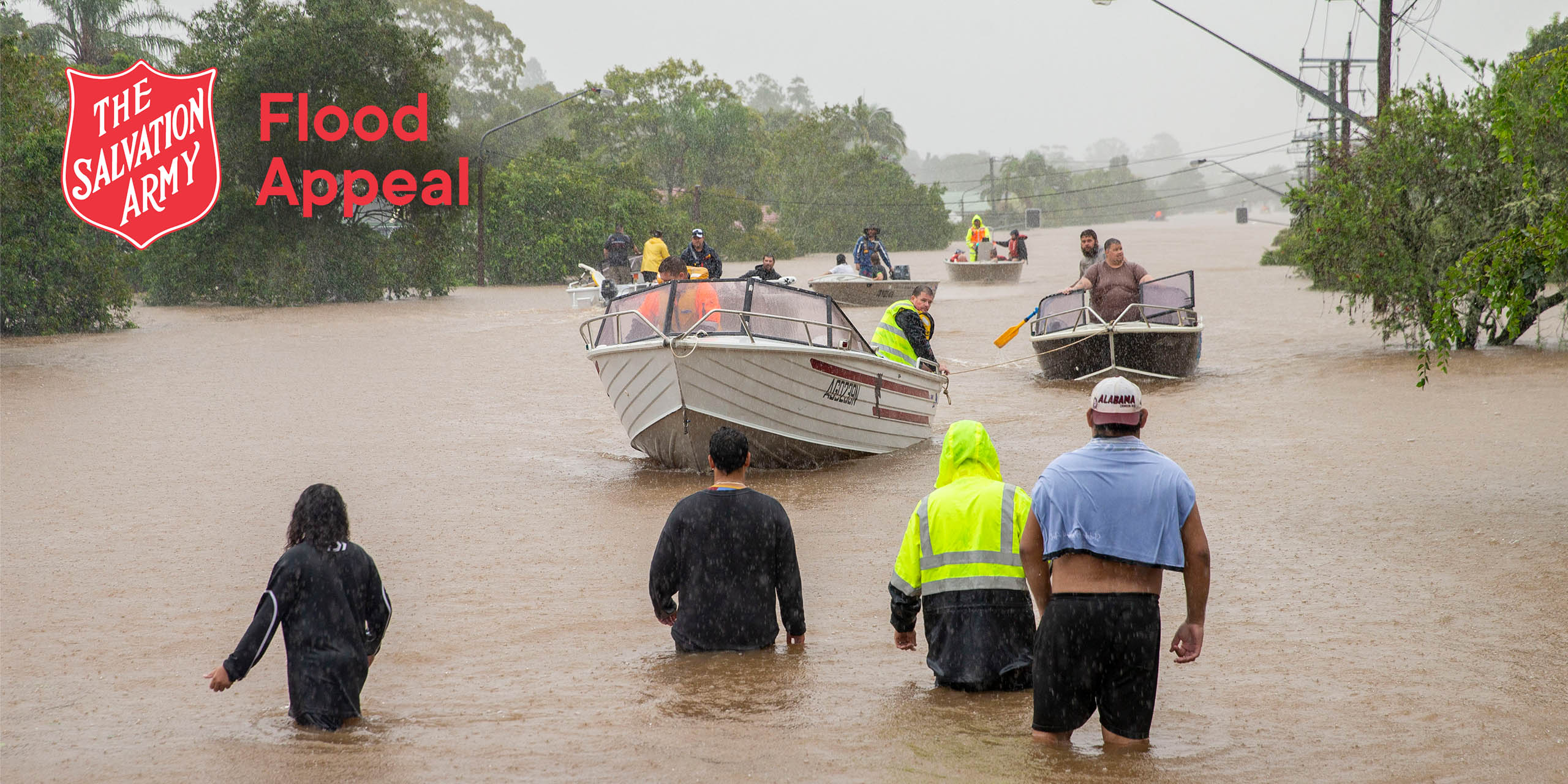 Residents wading in flood water