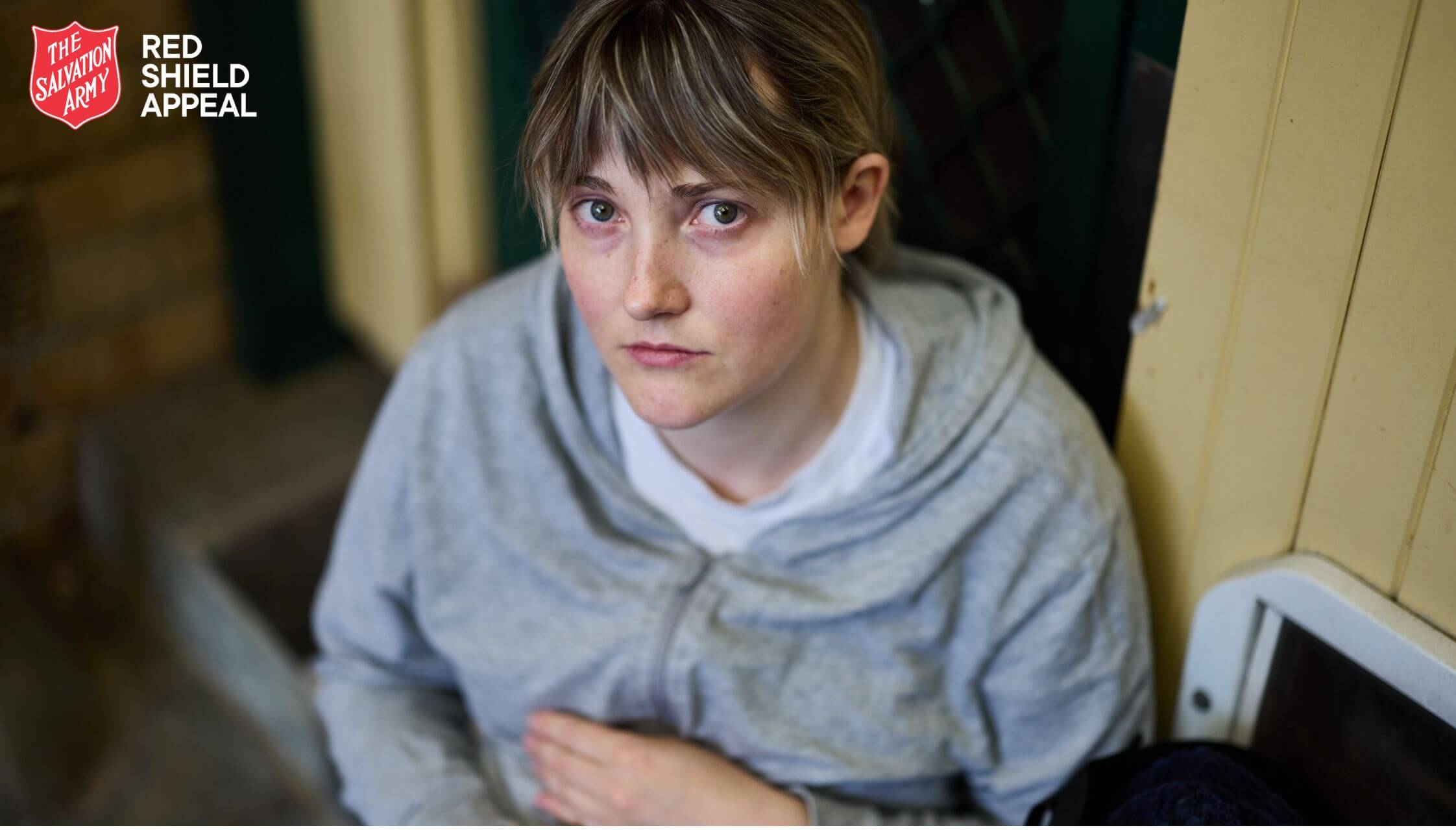 Emily looking distressed as she sits outside without a home for the night.