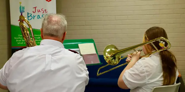 The Salvation Army's Colin Young accompanies a Just Brass student