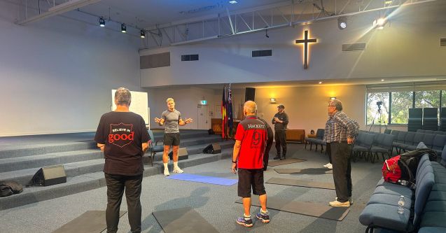 A small personal training group of men in a Salvos church