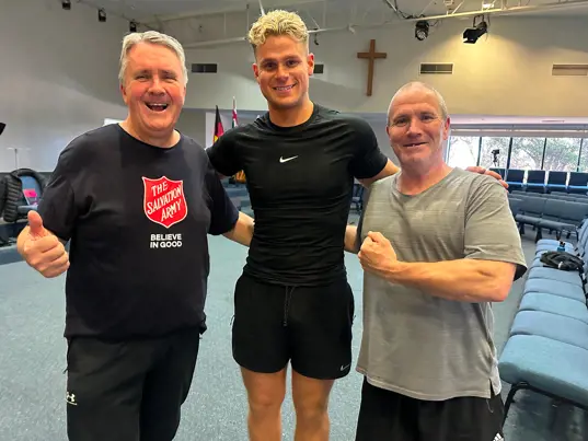 Personal trainer Zac (centre) spent five weeks encouraging and training participants