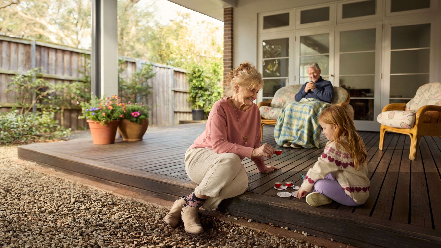 Two grandparents spend some time with their young granddaughter.