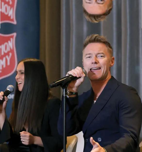 Ronan Keating is crooning with the help of a backing singer