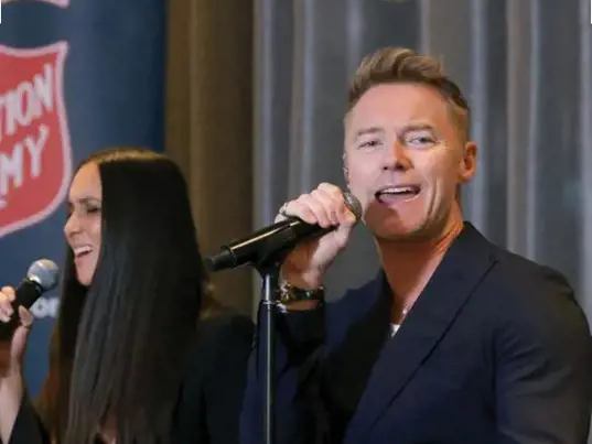 Ronan Keating is crooning with the help of a backing singer