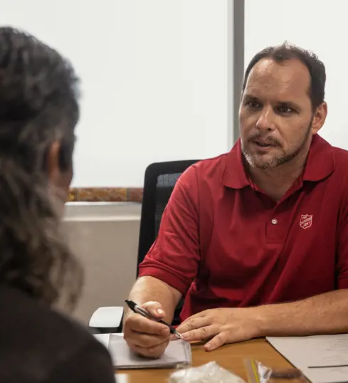 Two people speaking in an office