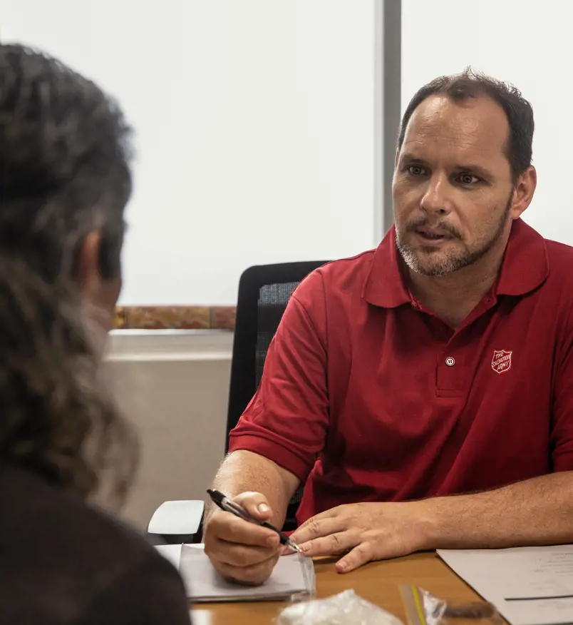 Two people speaking in an office
