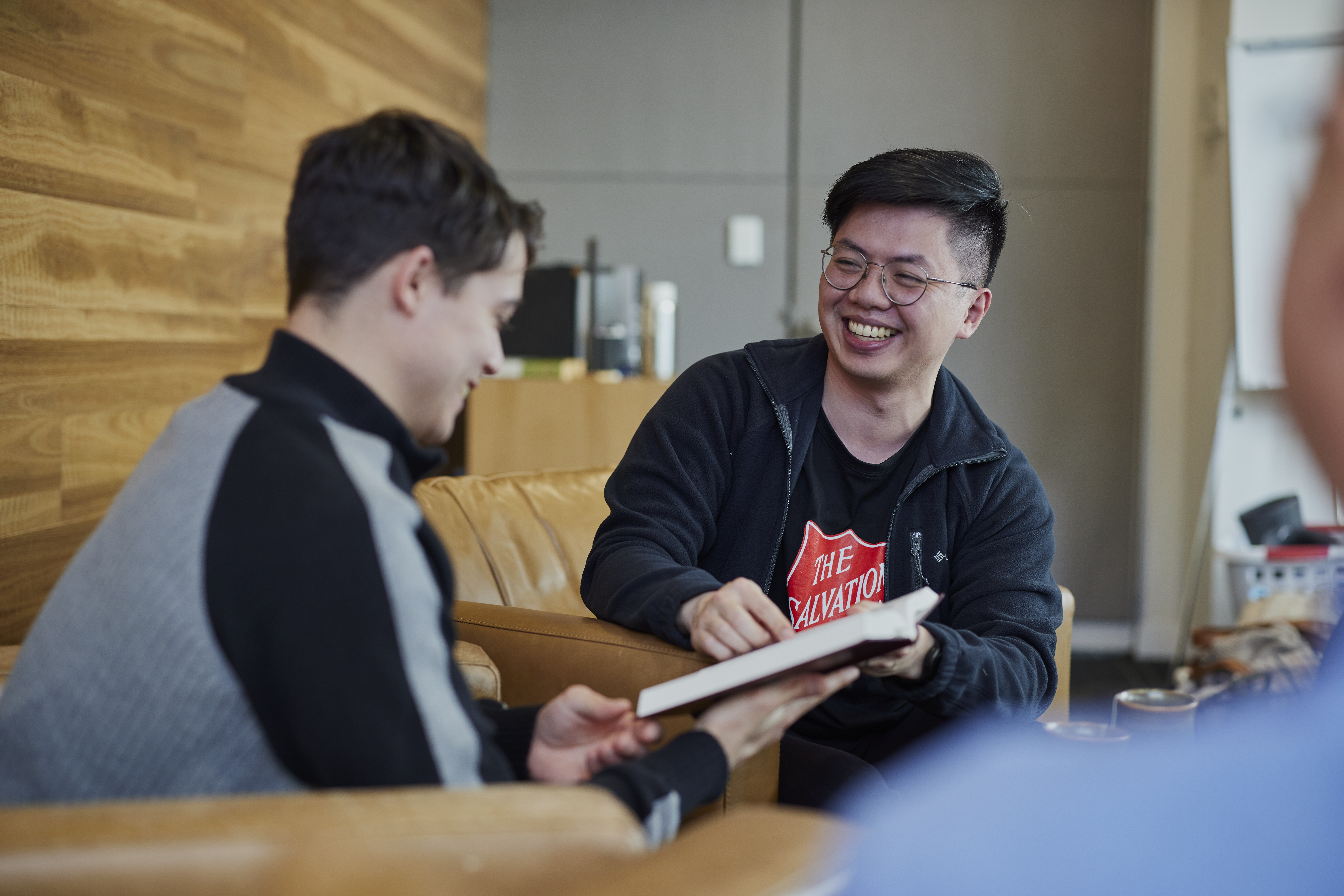 A Salvos worker works on new strategies with a client.
