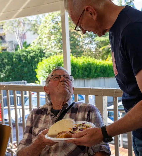 Man being served lunch