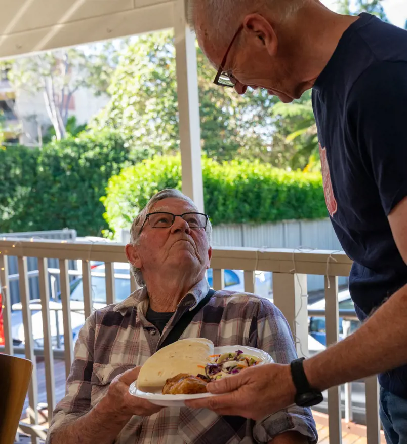 Man being served lunch