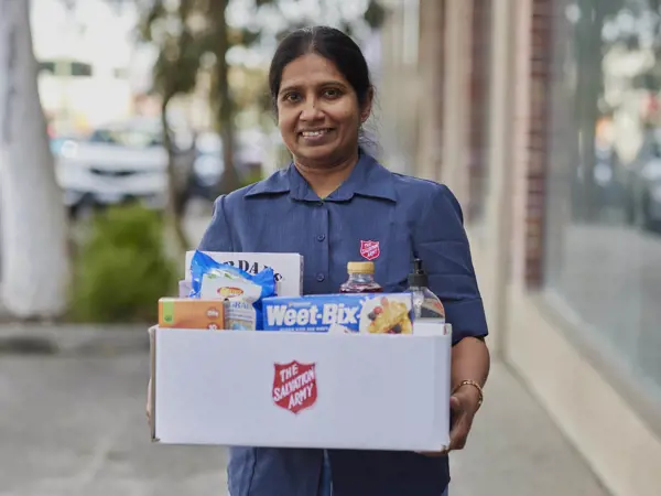 Woman with box of donated goods