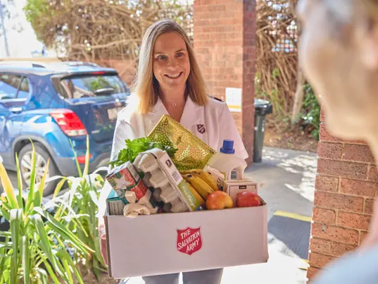 Officer delivering hamper