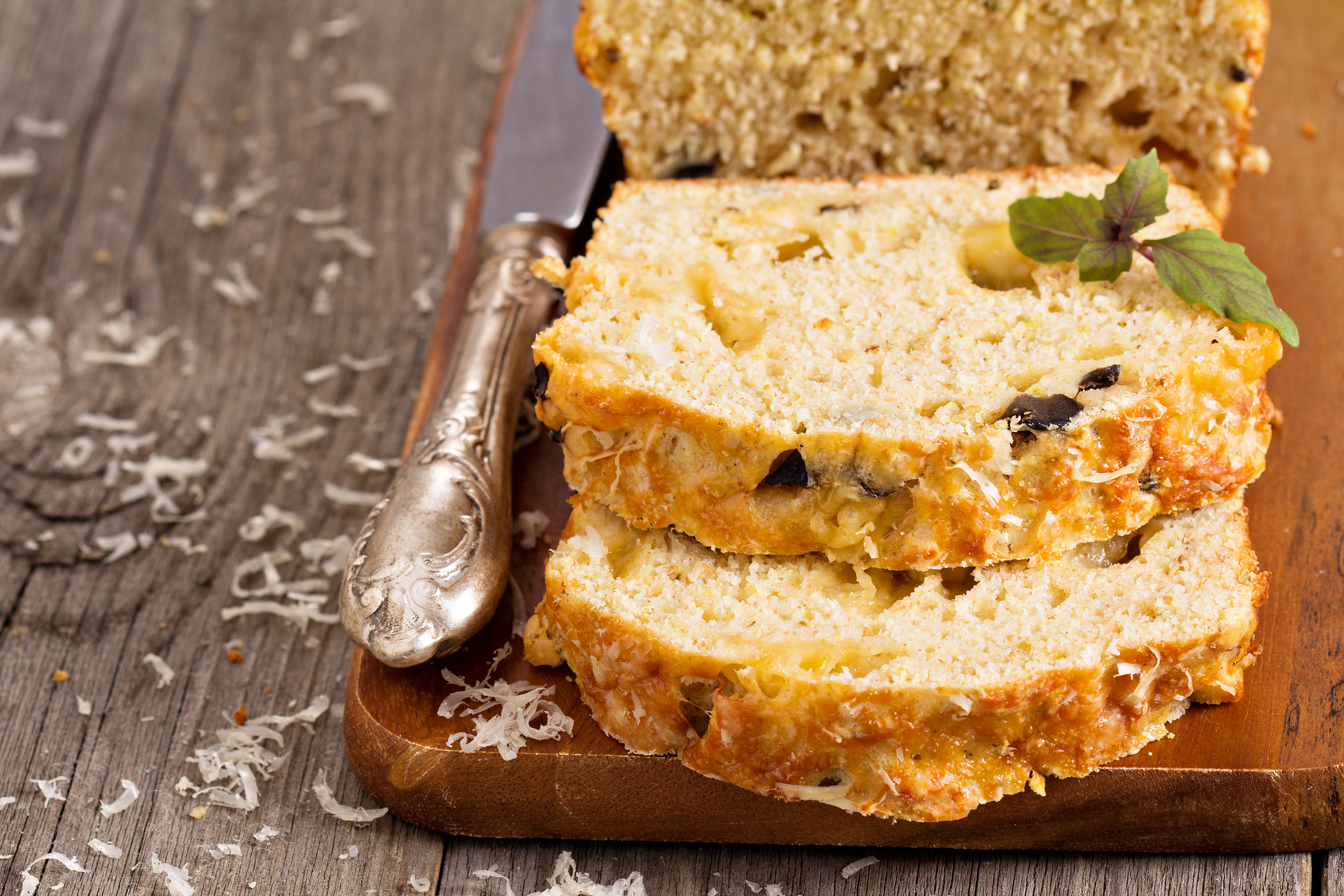 Zucchini slice on a wooden board.