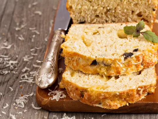 Zucchini slice on a wooden board.