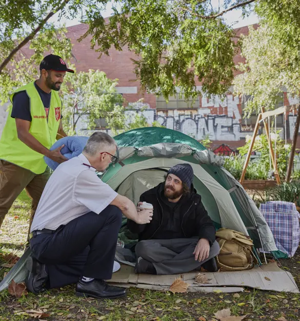 Salvos helping someone experiencing homelessness and living in a tent