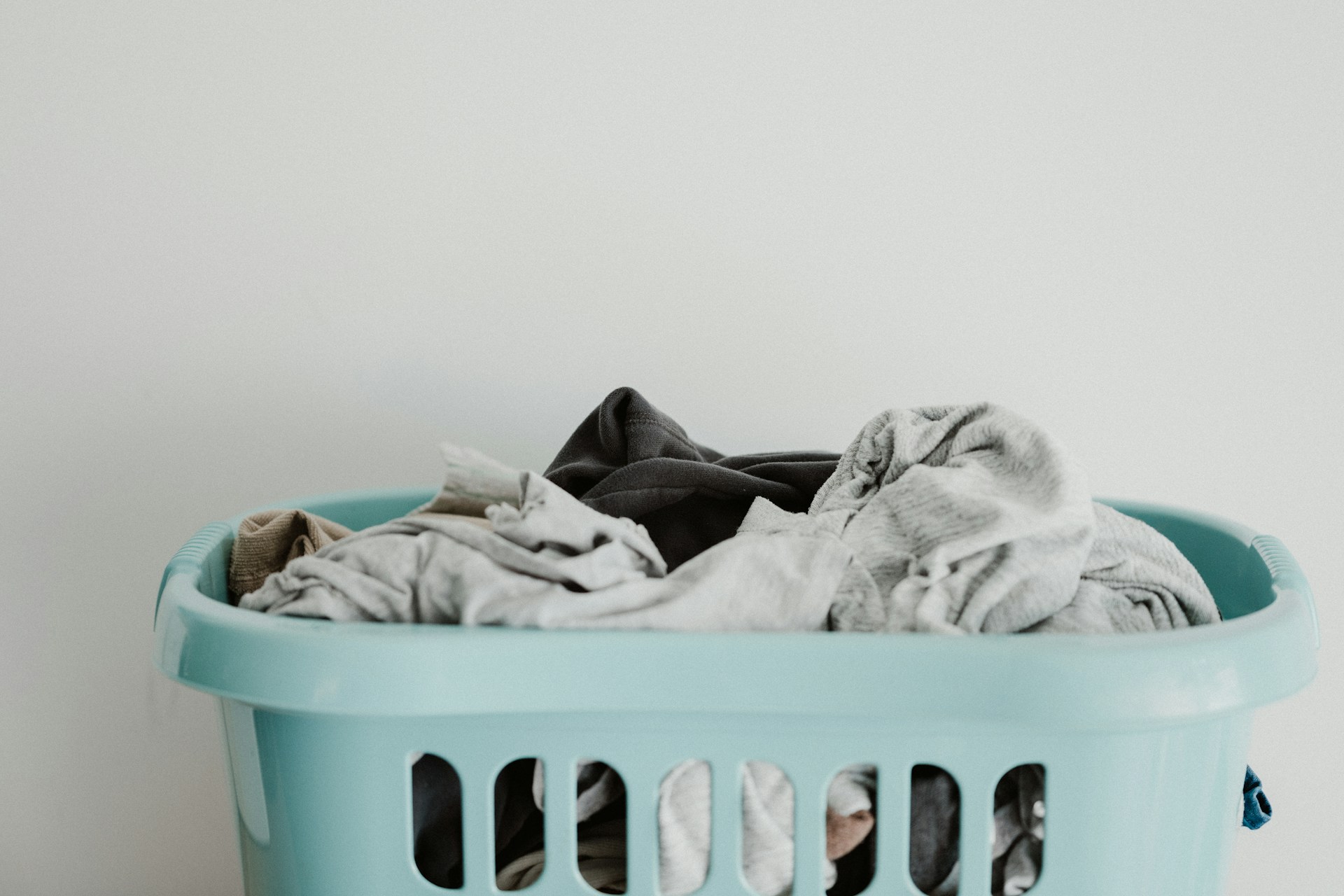 Basket of clothing for laundry.