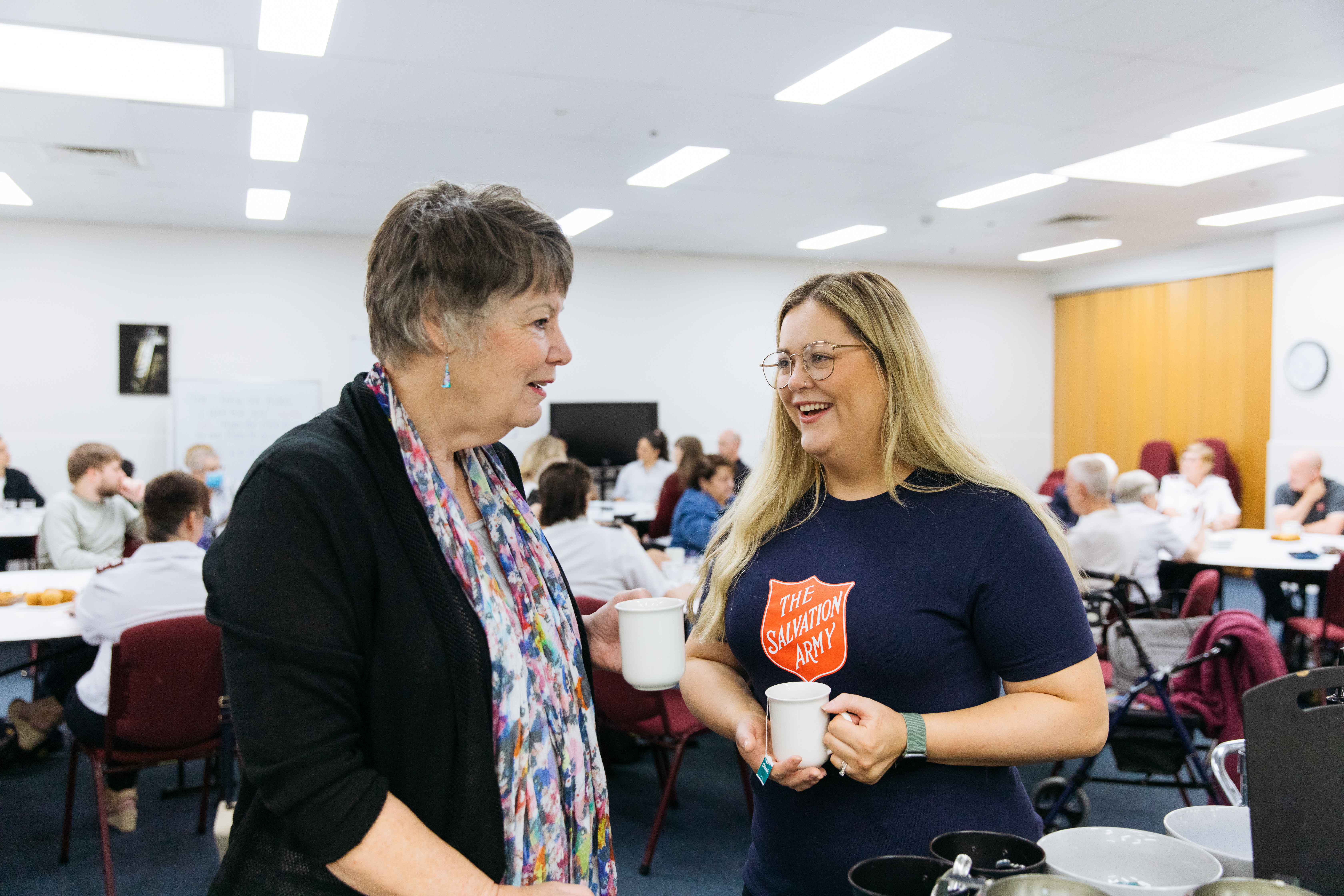 Two women talking while drinking tea
