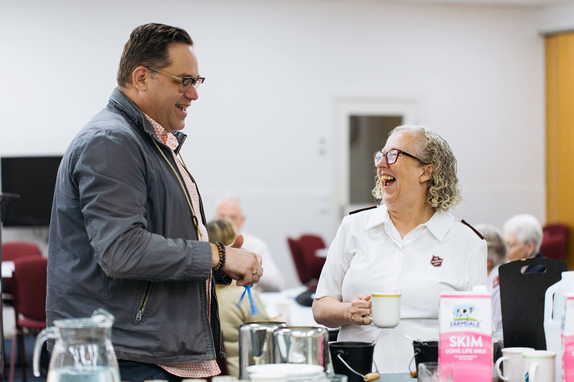Salvos officer having coffee and interacting